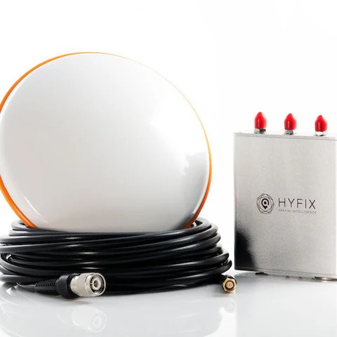 RTK base station kit: antenna, correction radio, and cabling laid out together